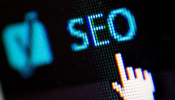 black screen with SEO written in blue and a computer cursor underneath