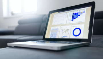 laptop displaying charts and graphs