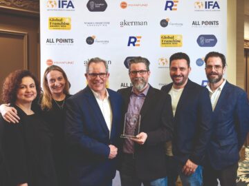 The Reshift Media team accepting the best franchise marketing firm award at the 2023 Global Franchise Awards in Las Vegas.