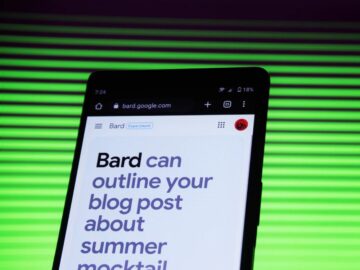 Mobile phone against neon green background with Google's Bard on the screen